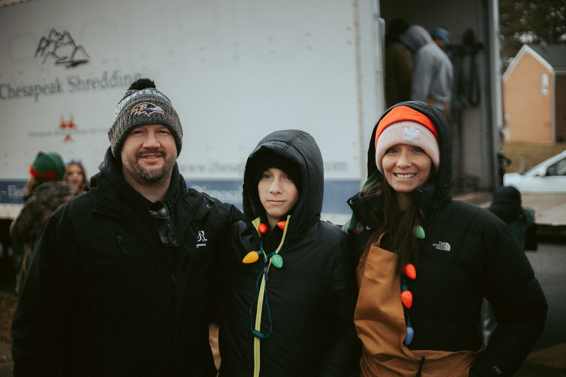 Volunteers helping set up a winter community event, showing the volunteering mental health winter connection through shared outdoor activity