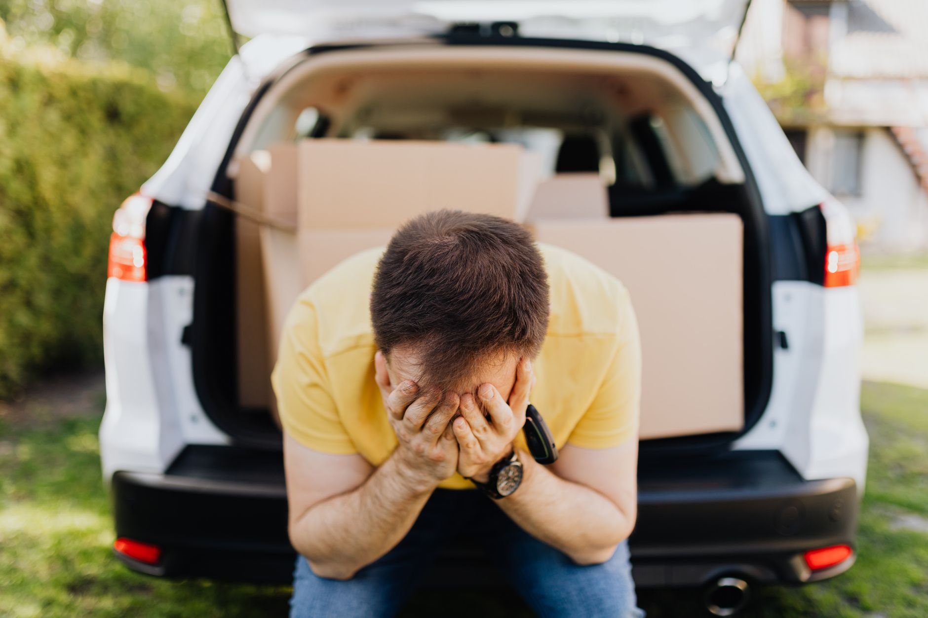 Man sitting in motorway traffic showing the physical and mental toll of commuting stress health effects UK drivers experience