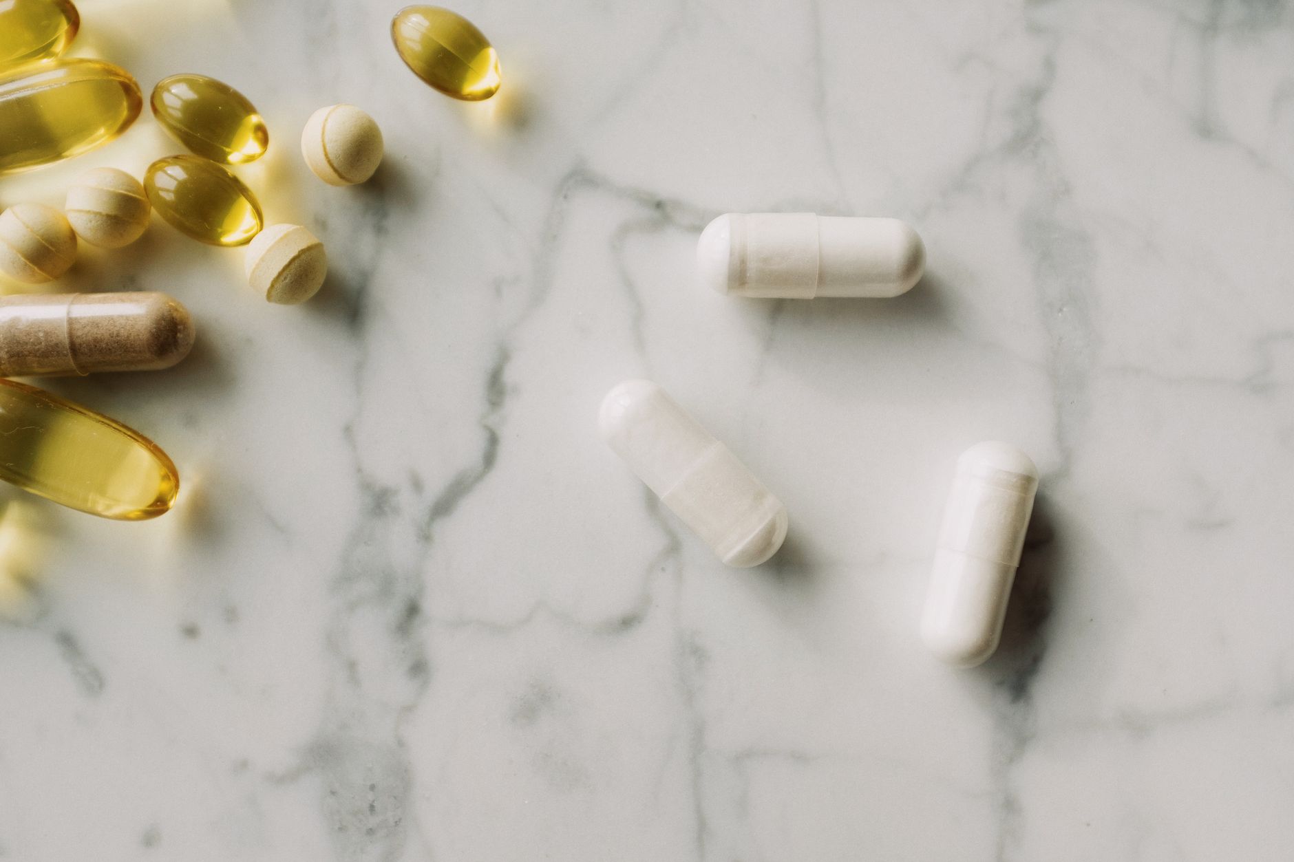 Vitamin D3 softgel capsules on a wooden surface — vitamin D supplement not working UK